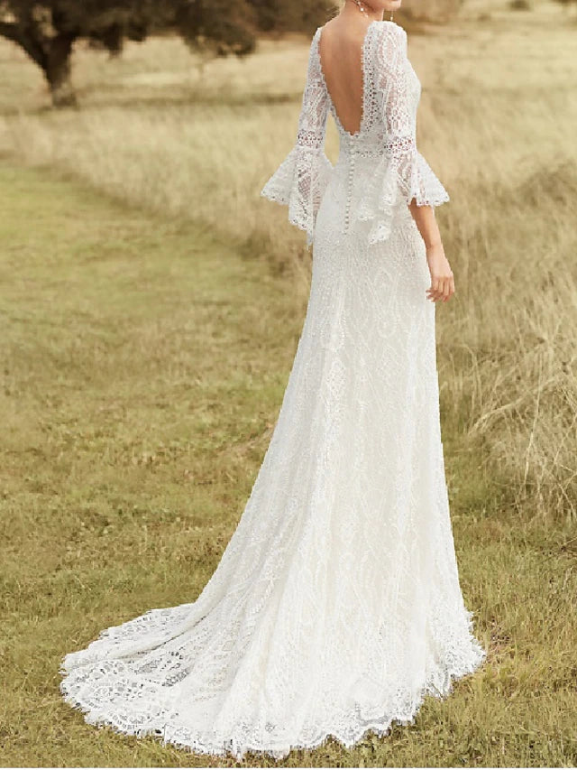 Full length view of the elegant white boho wedding gown.