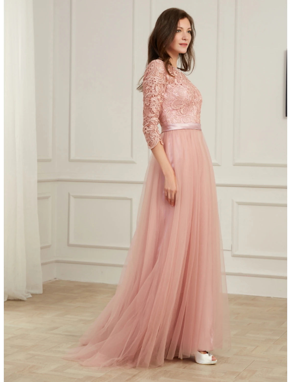 Side profile of the A-line dress, highlighting its silhouette and flowing skirt.