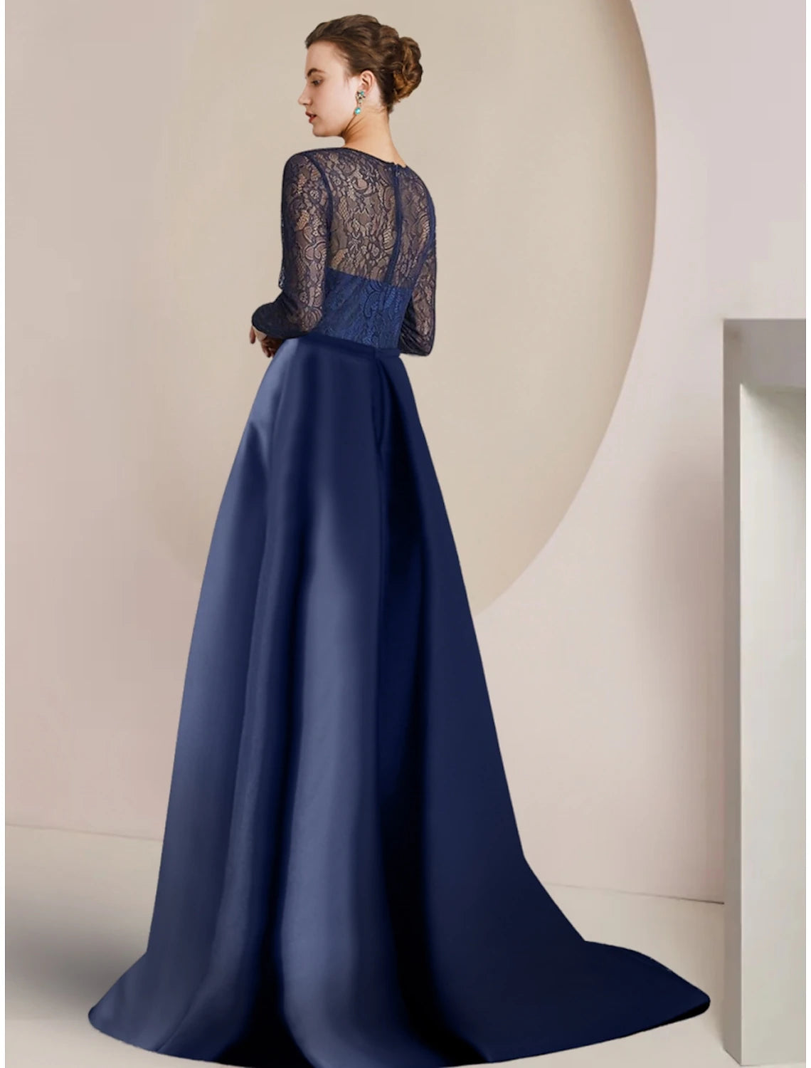 Side view of the A-Line formal gown, showing ruching and sweep train.