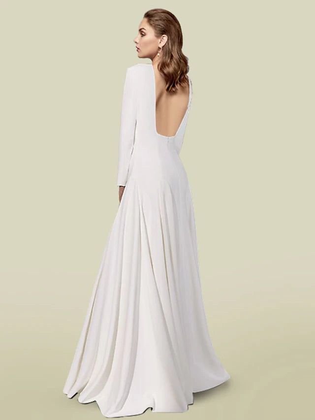 Back view of the floor-length pleated satin dress.
