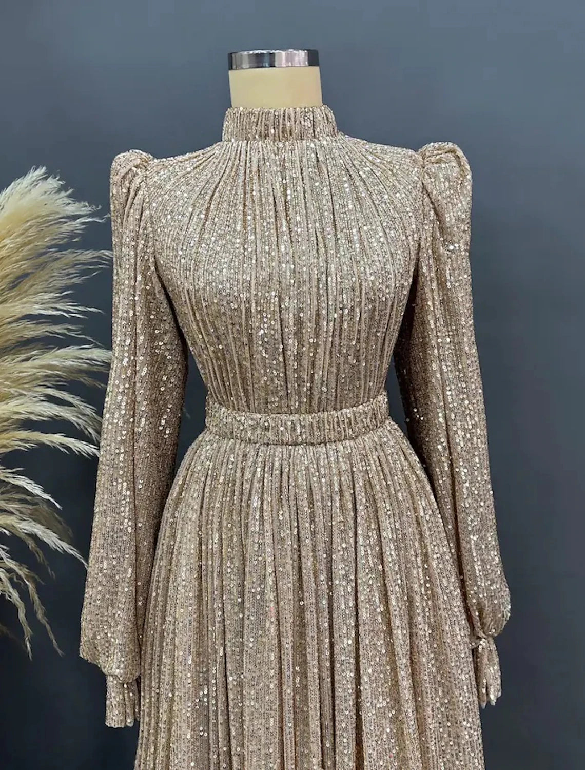 Back view of the elegant A-line sequined black evening gown, showcasing ruched details.