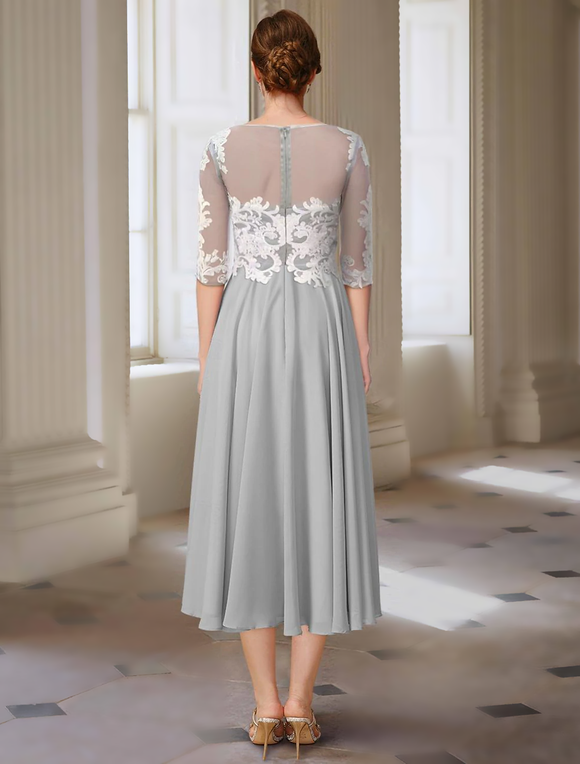 Back view of the A-line Mother of the Bride dress showing intricate appliques.