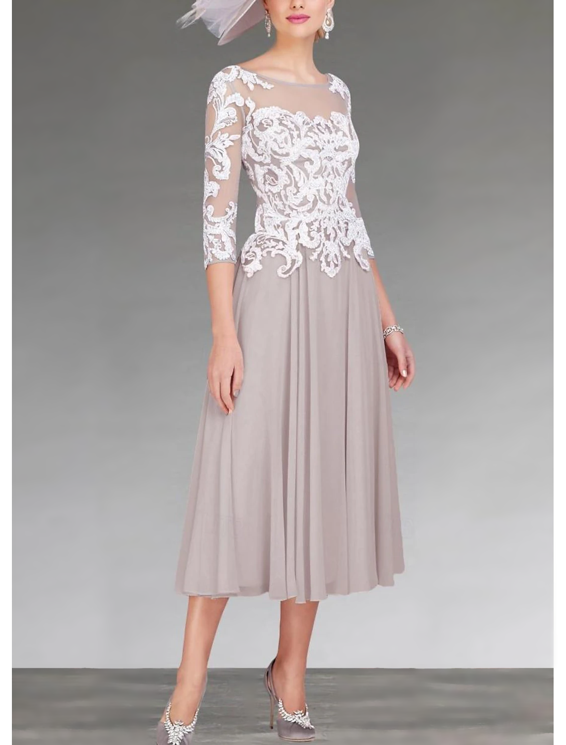 Close-up of the chiffon lace fabric and delicate appliques on the dress.