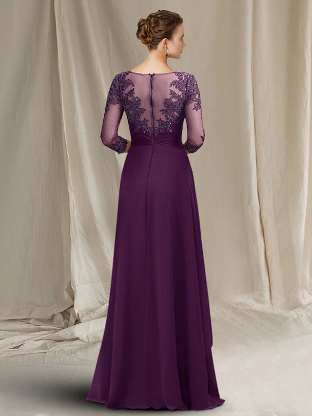 Back view of the navy blue A-line gown, showcasing lace and sequin details.