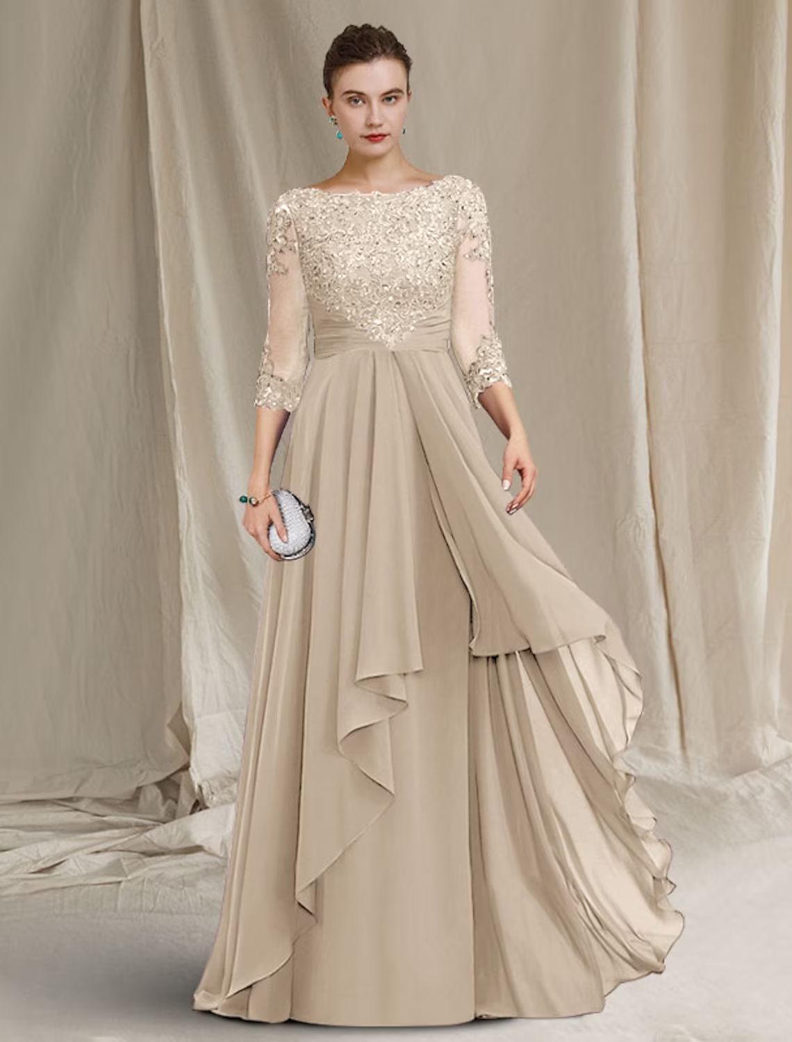 Full length view of the navy blue Mother of the Bride dress, showing the flowing chiffon skirt.