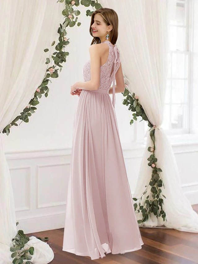 Back view of a floor-length A-line bridesmaid dress, showcasing pleats and flowing chiffon.