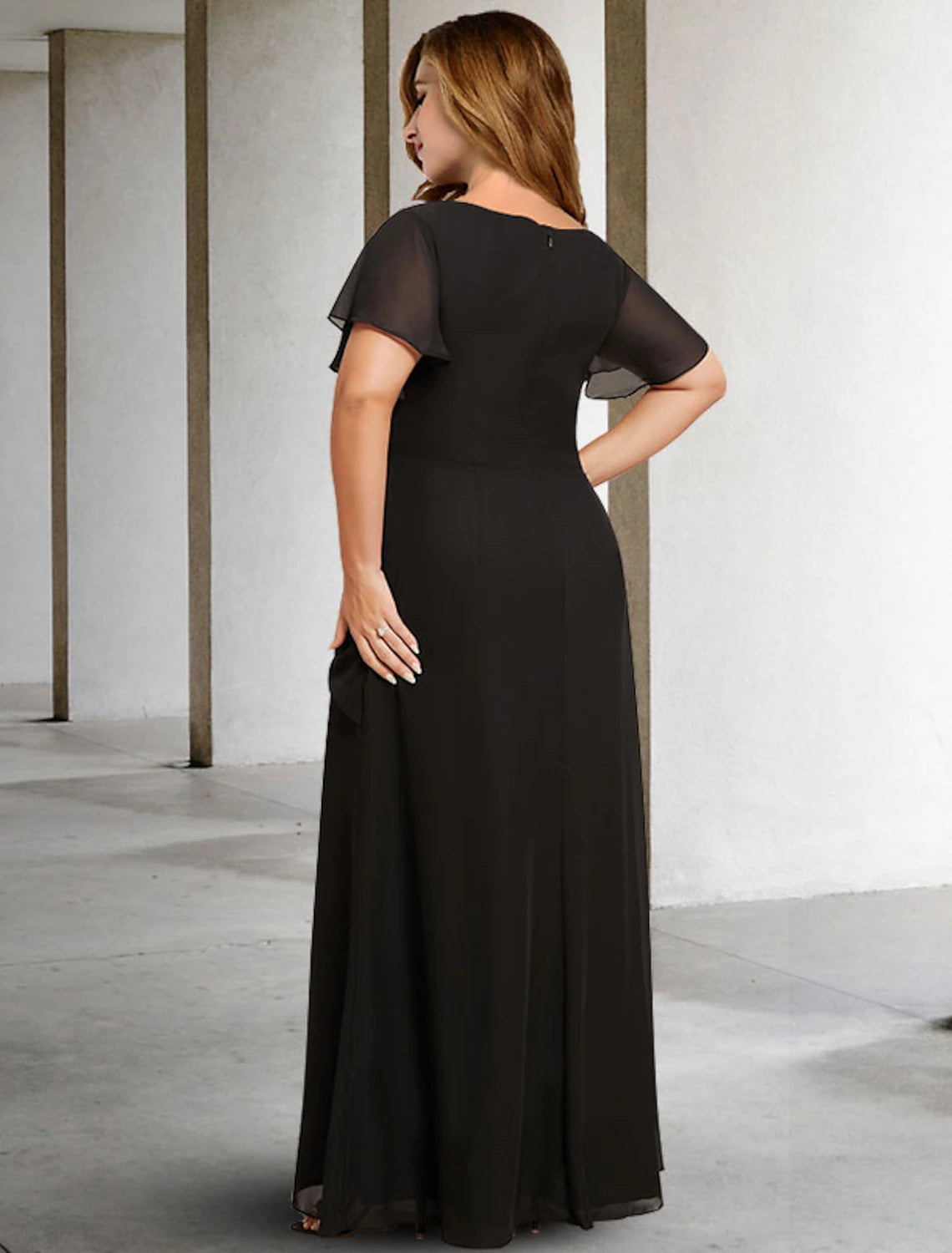 Side profile of the plus size Mother of the Bride dress, highlighting the flattering silhouette.