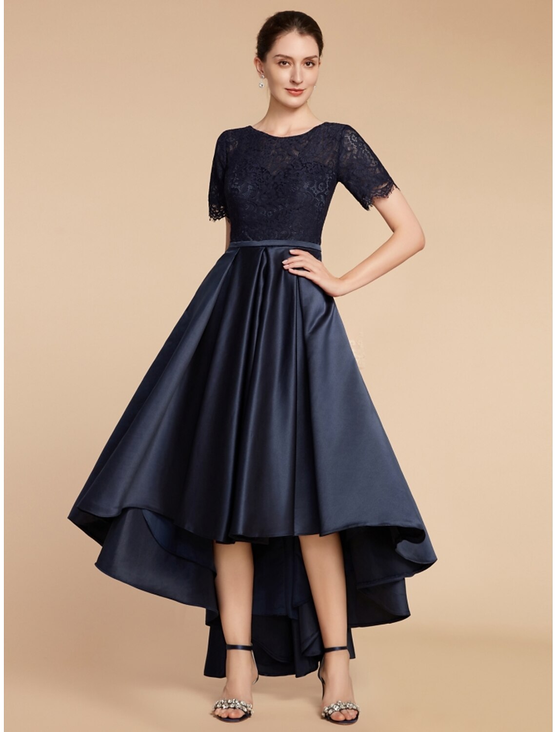 Elegant A-line mother of the bride dress in navy with jewel neck and short sleeves.