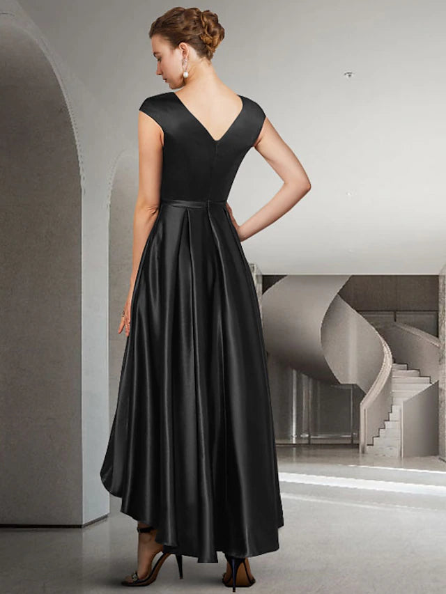 Back view of the A-line satin dress, showing asymmetrical high-low hem and pleats.