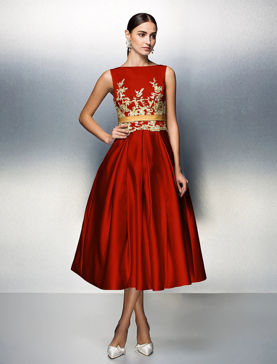 Back view of A-Line satin dress showing V-back and pleats.
