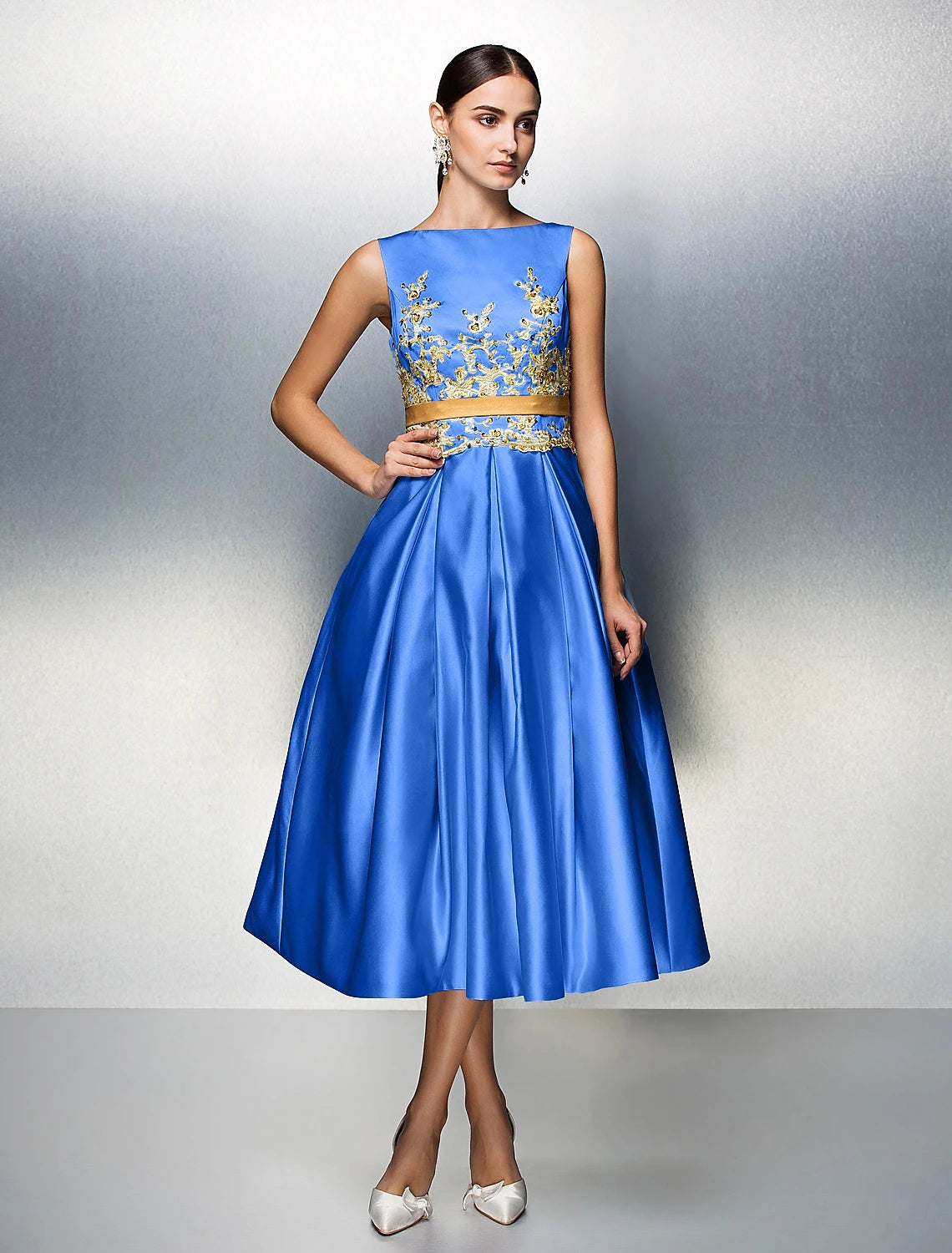 Side view of sleeveless A-Line cocktail dress.