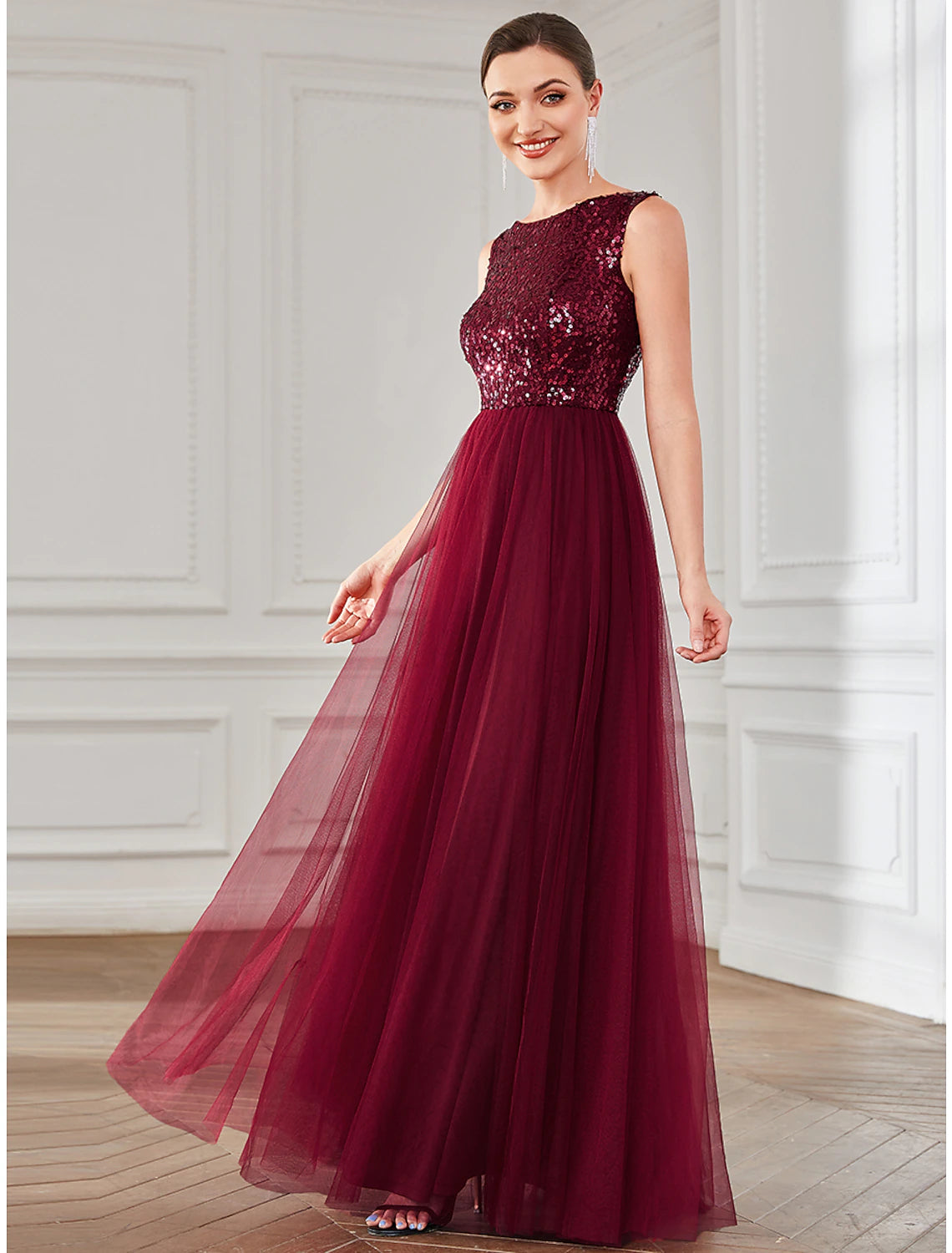 Back view of the A-line sequin tulle floor-length dress on a woman.