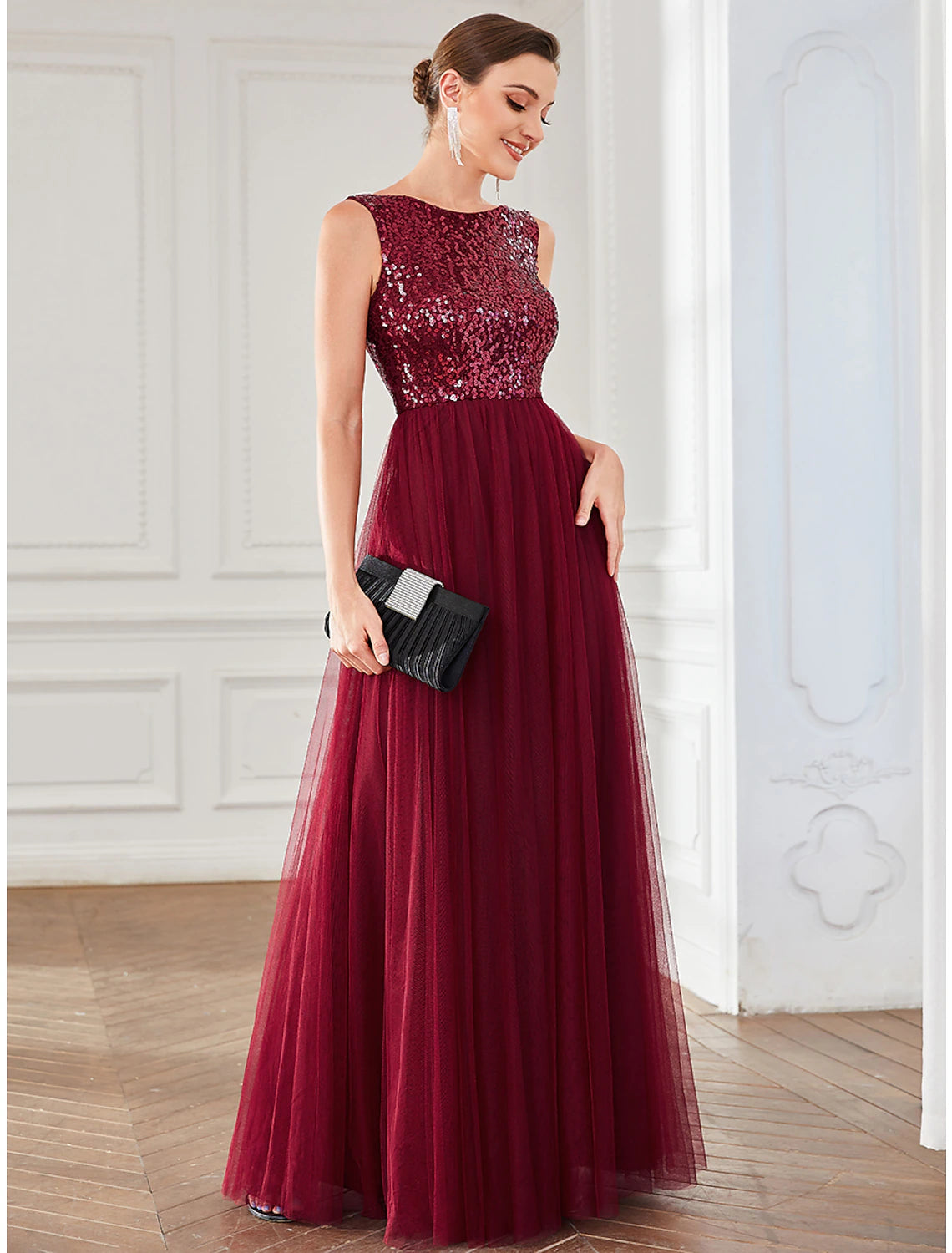Close-up of the shimmering sequin and delicate tulle fabric of the dress.