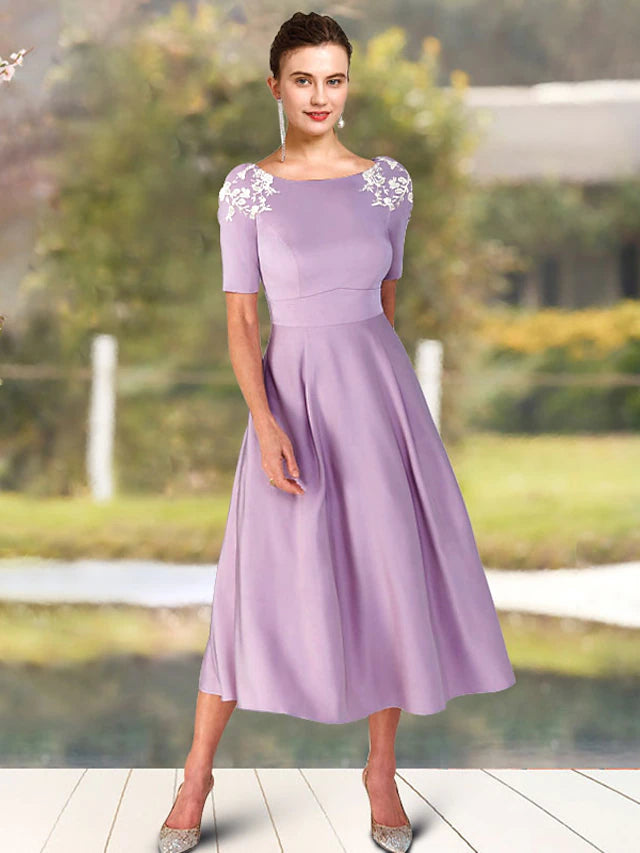 Elegant A-Line Charmeuse Mother of the Bride Dress with jewel neck and short sleeves, front view.