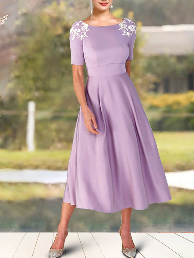 Side view of the tea length A-Line Mother of the Bride Dress with appliques.
