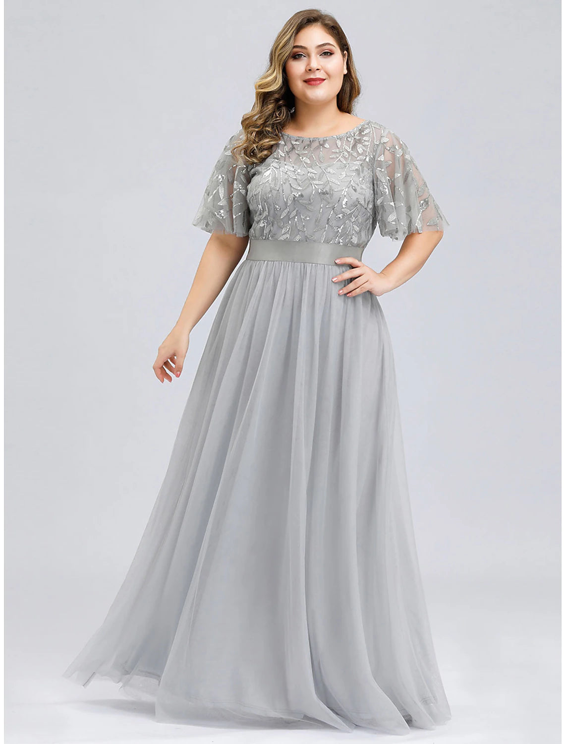 Back view of a floor-length A-line formal gown with appliques.