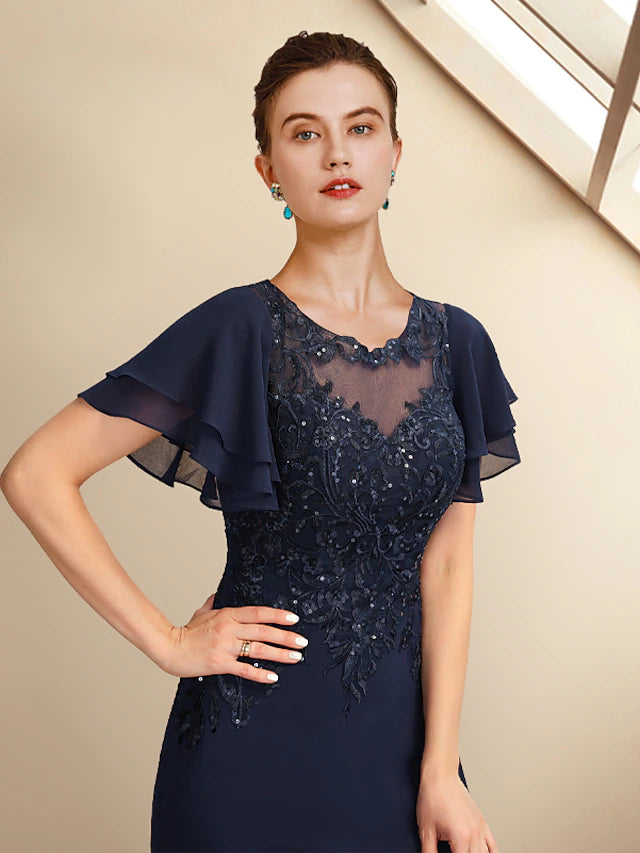 Side view of an elegant plus size Mother of the Bride gown, showcasing the floor-length chiffon and lace fabric.