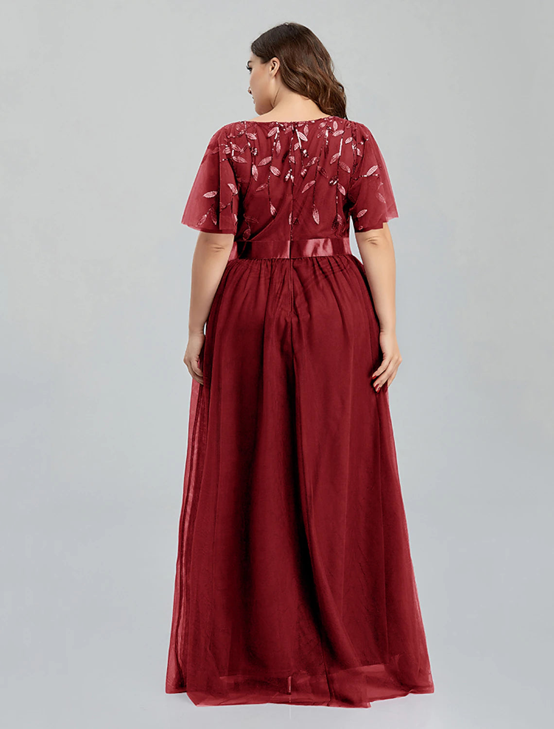 Side profile of the short sleeve quinceanera dress.