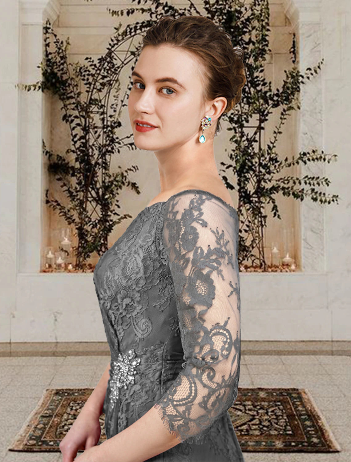 Back view of the floor-length navy blue lace dress.