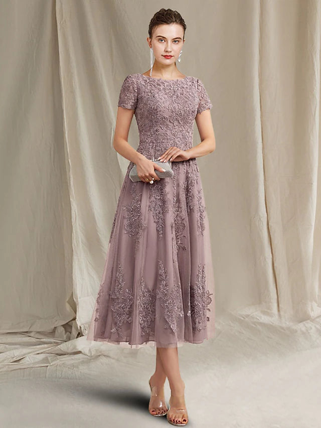 Elegant A-Line Mother of the Bride dress with jewel neck and short sleeves.
