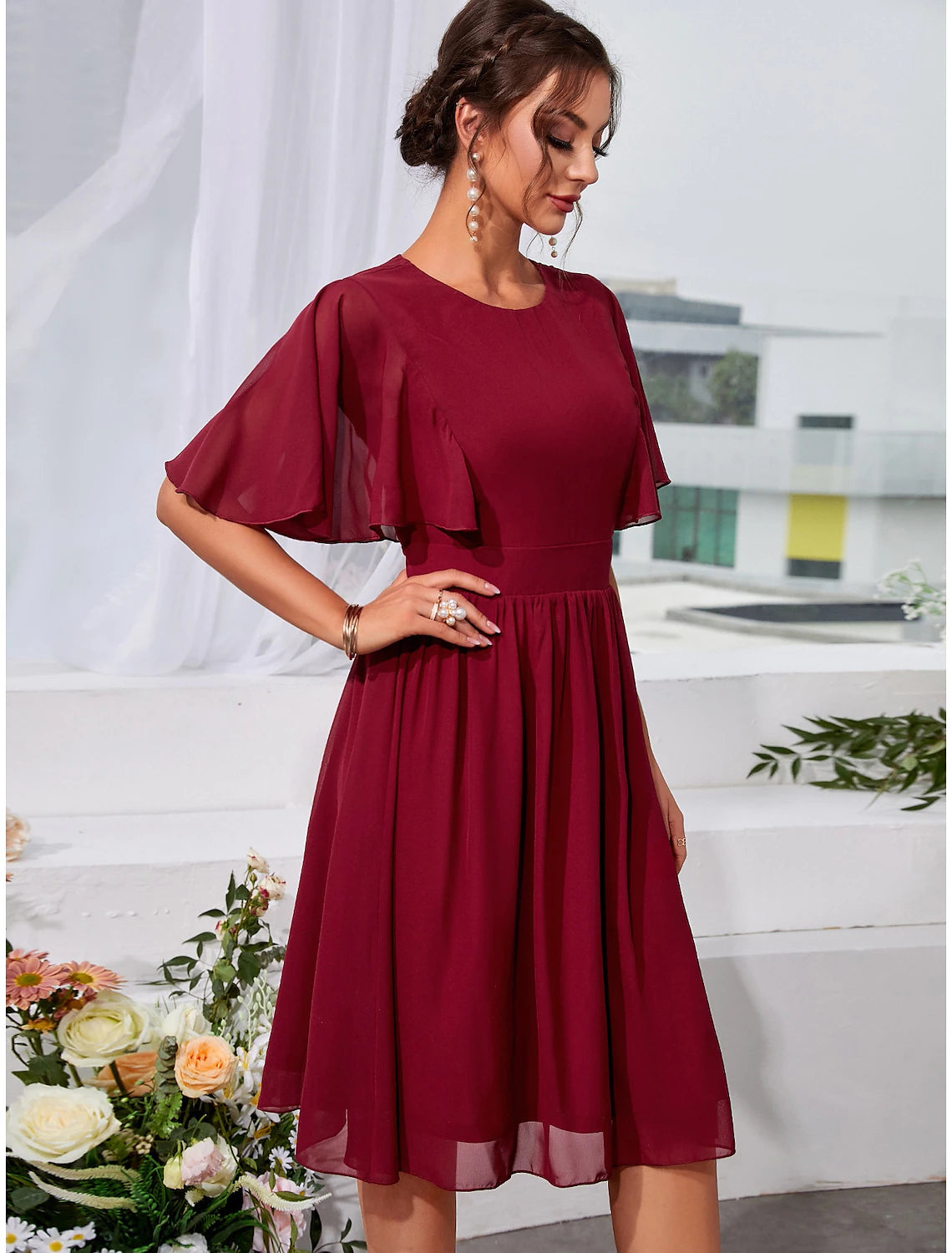 Back view of elegant short sleeve wedding guest dress.