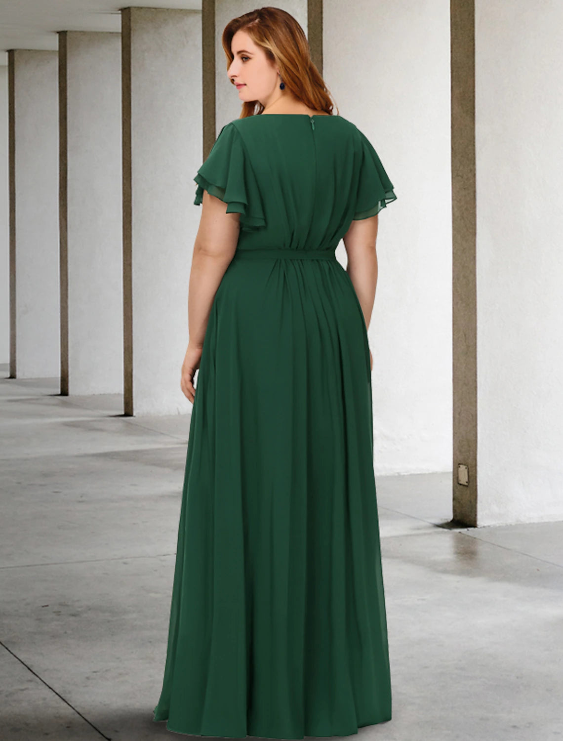 Side profile of the plus size floor-length Mother of the Bride dress.