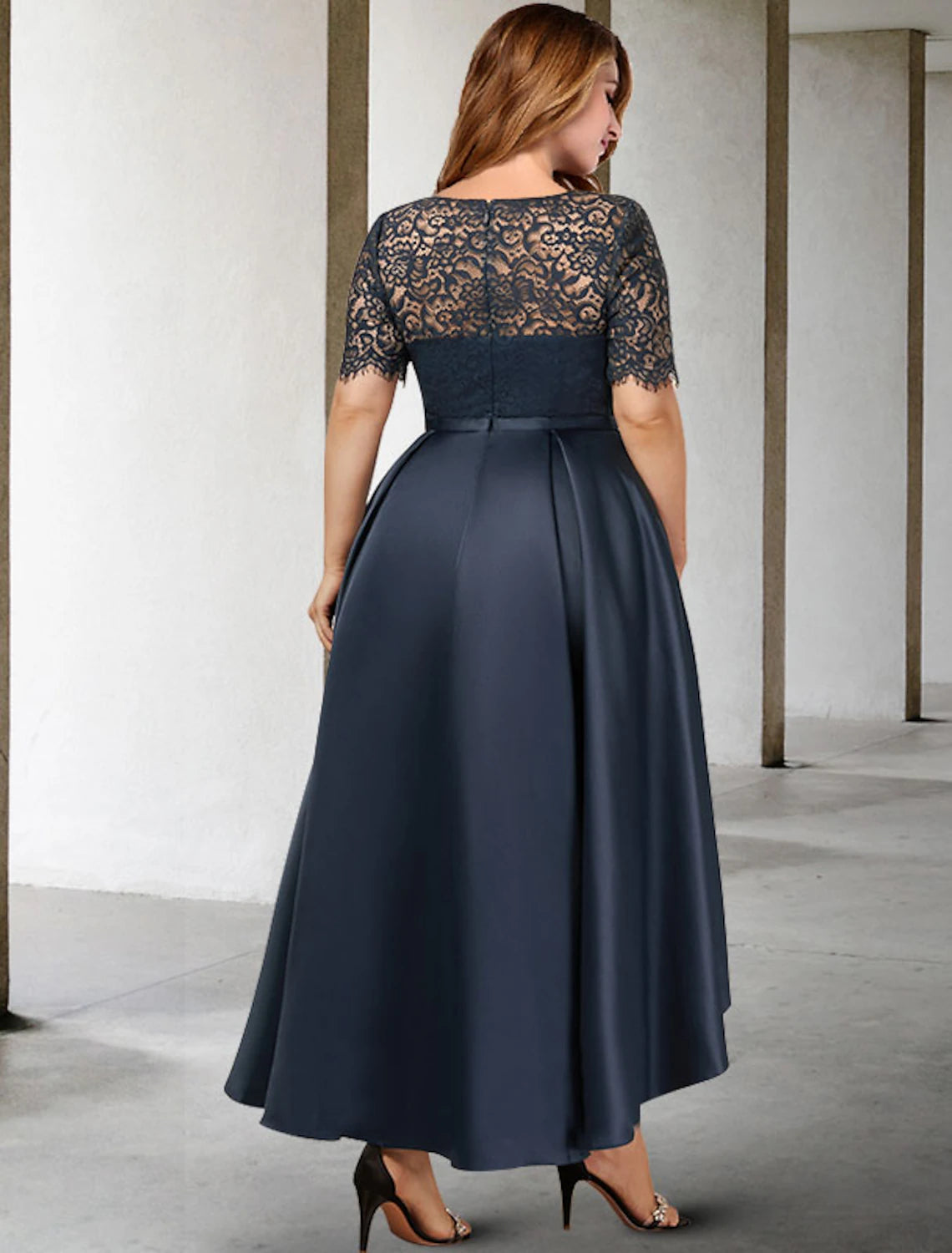 Back view of the elegant A-line plus size Mother of the Bride dress, highlighting the graceful silhouette.