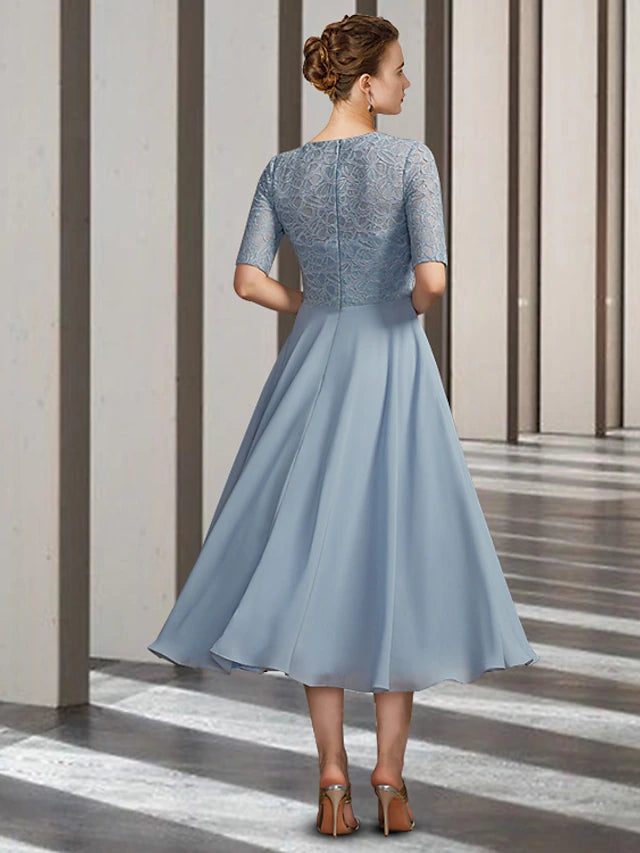 Close-up of ruched chiffon and lace details on a tea-length formal dress.