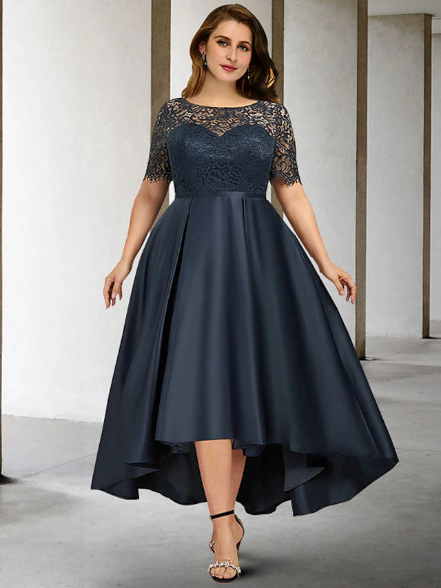 Woman wearing an elegant A-line satin Mother of the Bride dress with jewel neck and short sleeves.