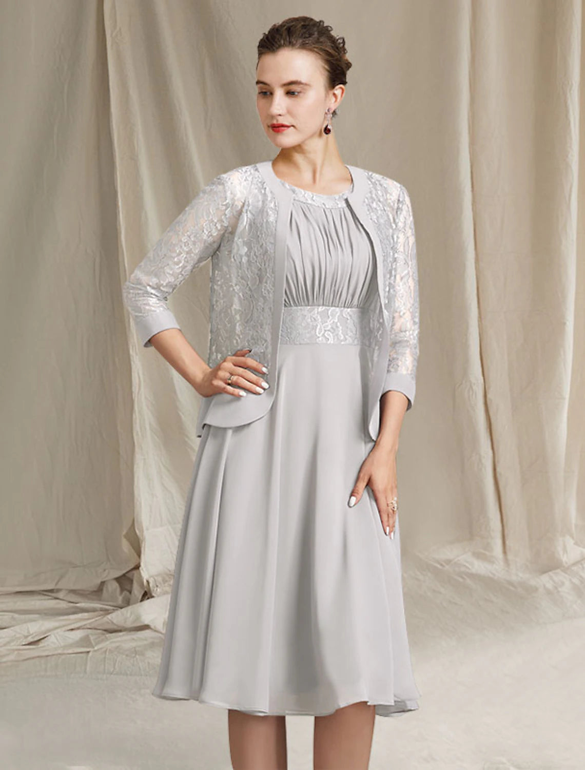Full length view of the elegant church attire, showcasing the knee-length hem.
