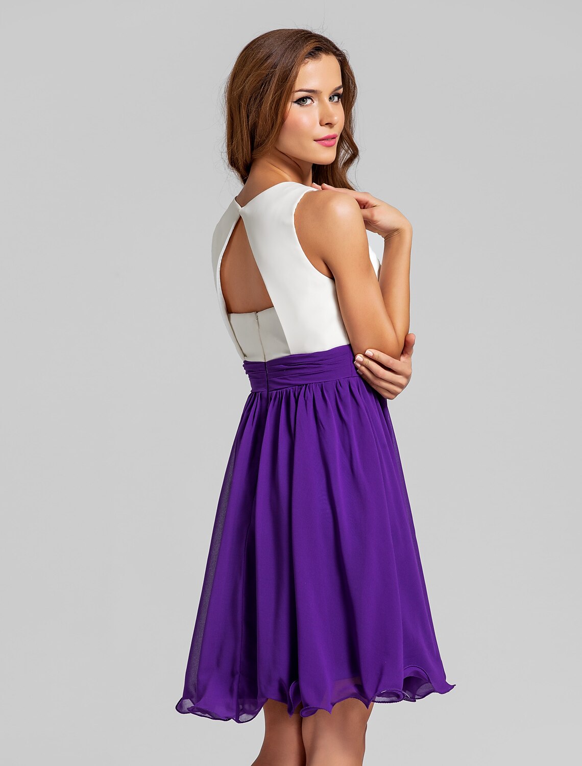 Detail of the flowing short chiffon skirt of the A-line dress.