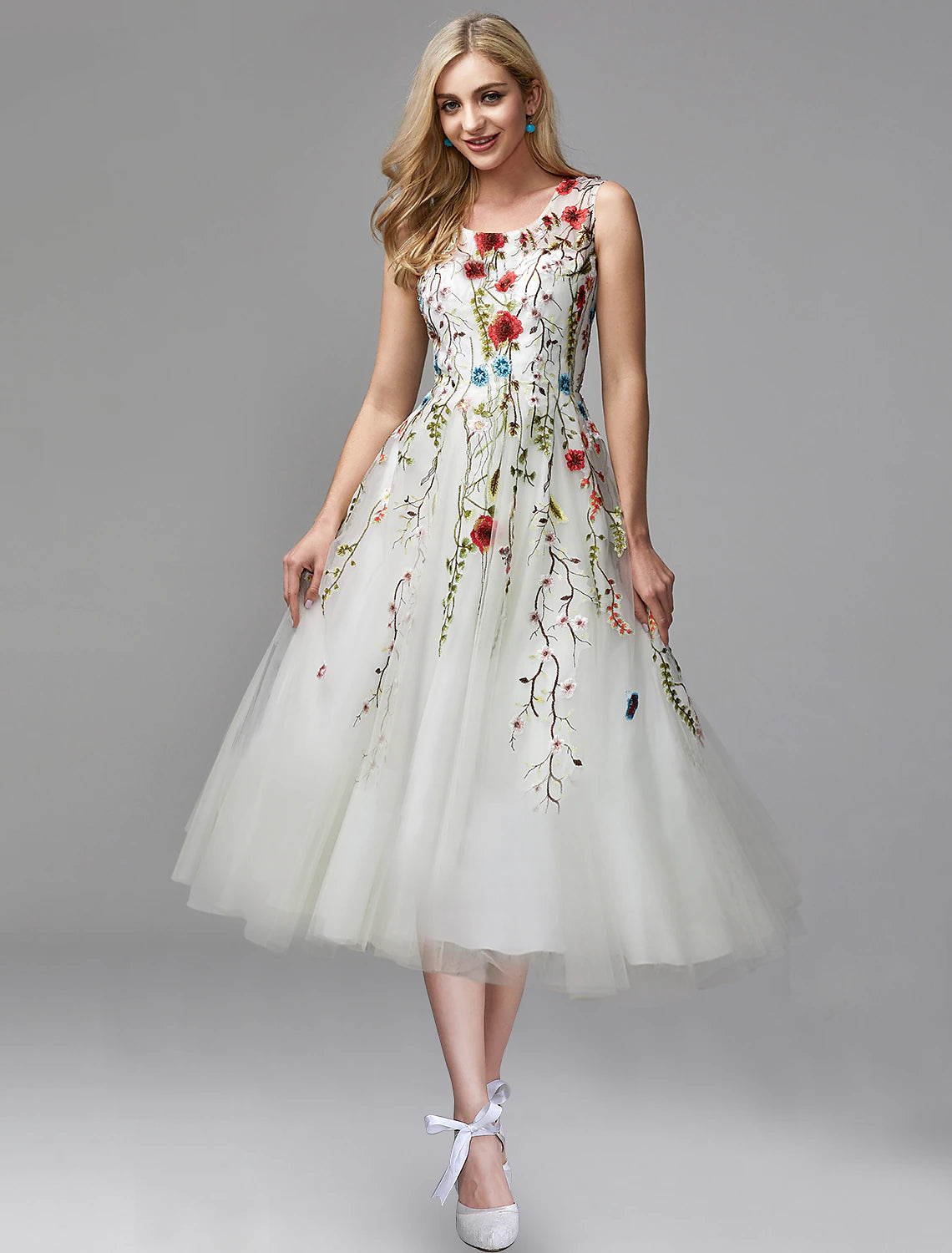 Elegant A-line prom dress with jewel neck and floral lace appliques.