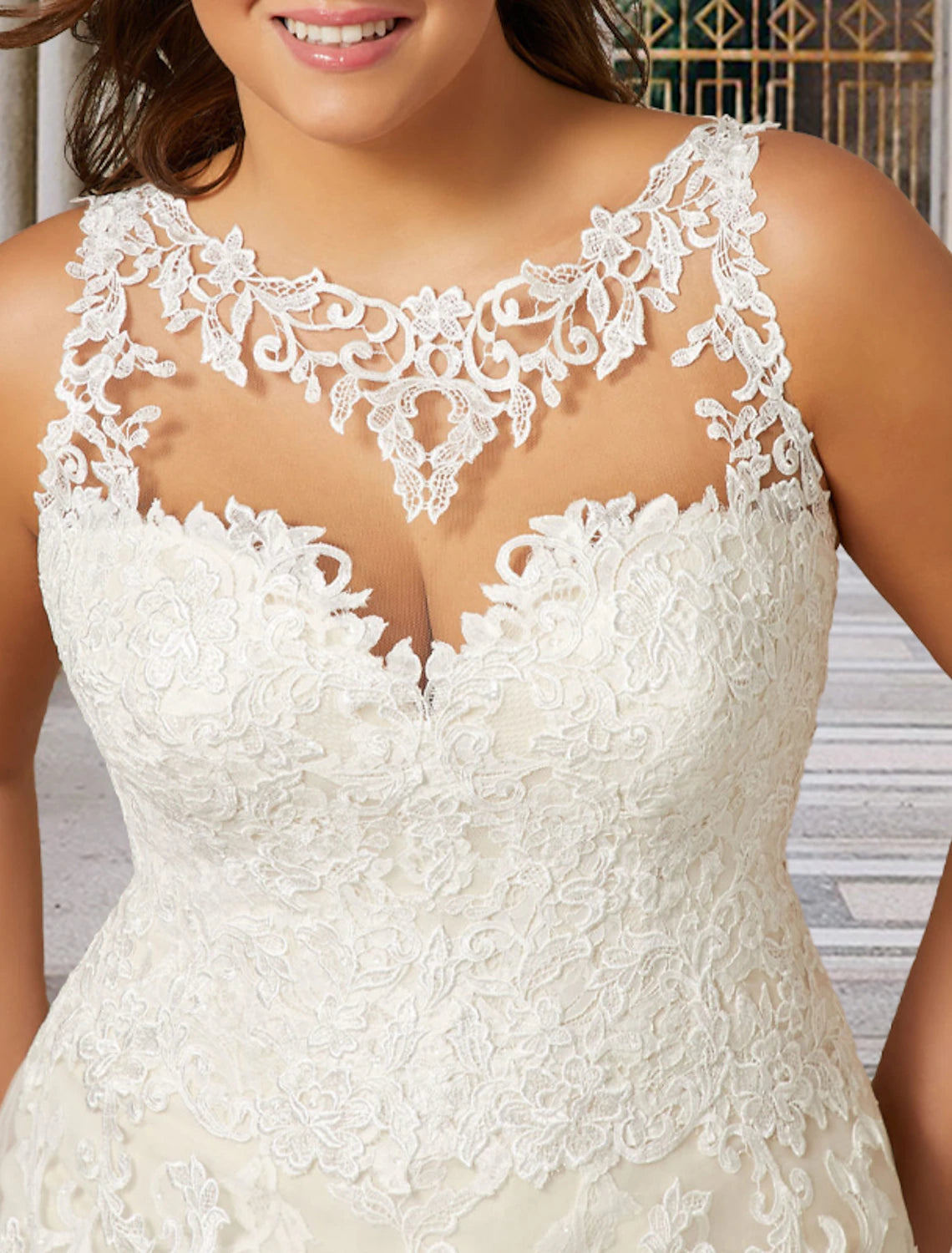 Side view of elegant plus size bridal dress with lace details.