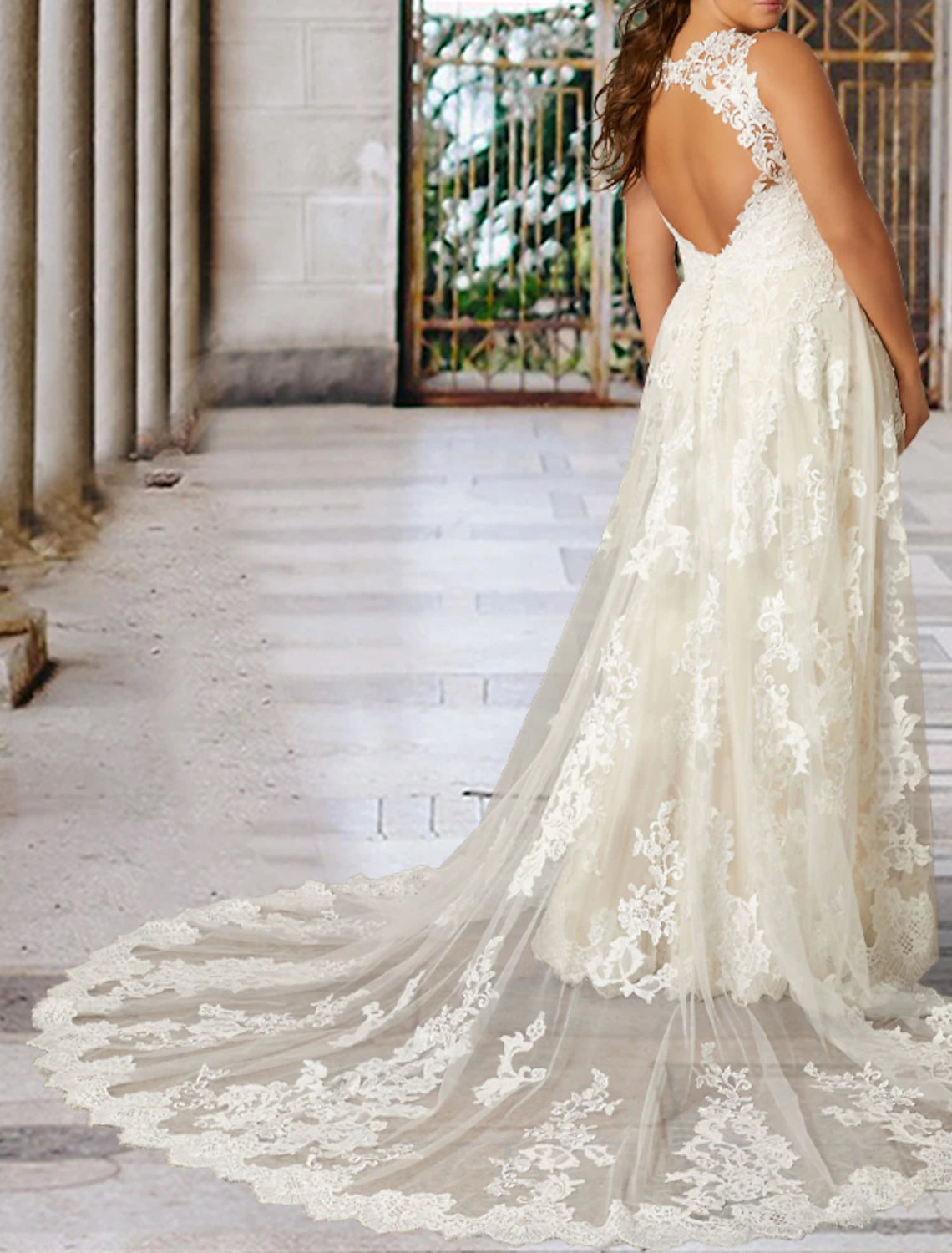 Close-up of lace appliques on a plus size wedding dress.