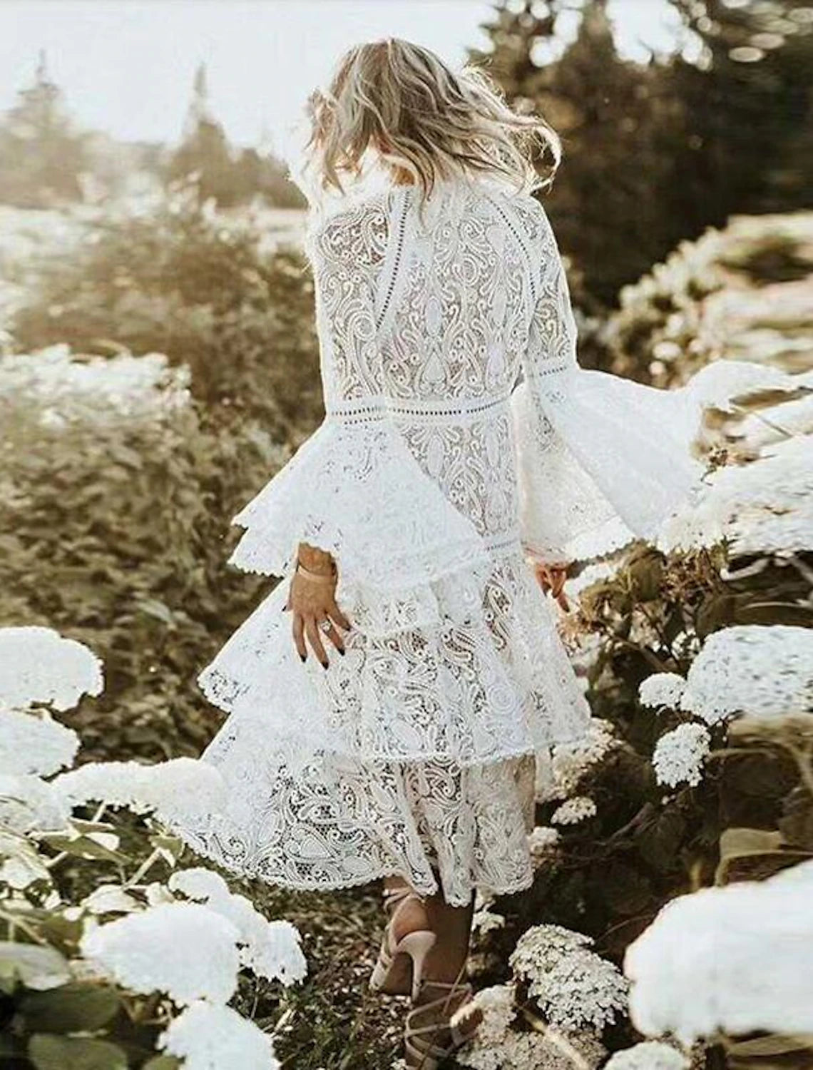 Back view of the A-line jewel neck wedding dress.