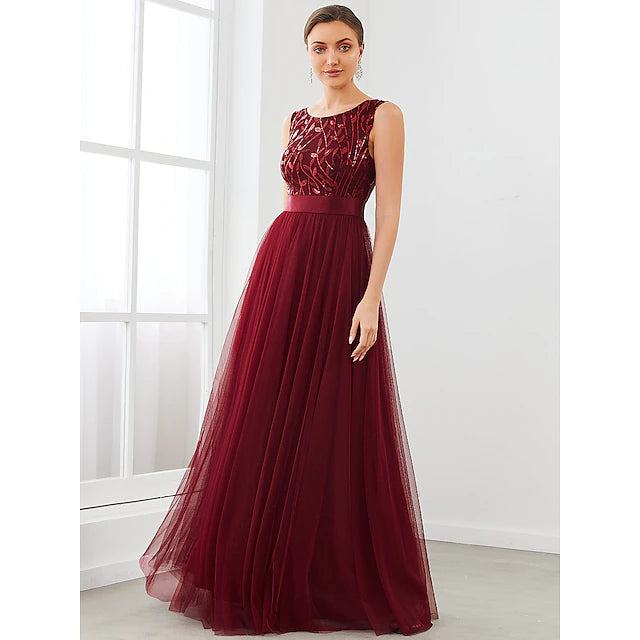 Side view of a sleeveless A-Line bridesmaid dress showing tiered tulle skirt.