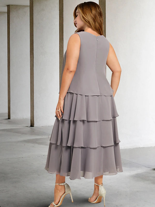 Close-up of the jewel neck and ruffled details on the two-piece dress.