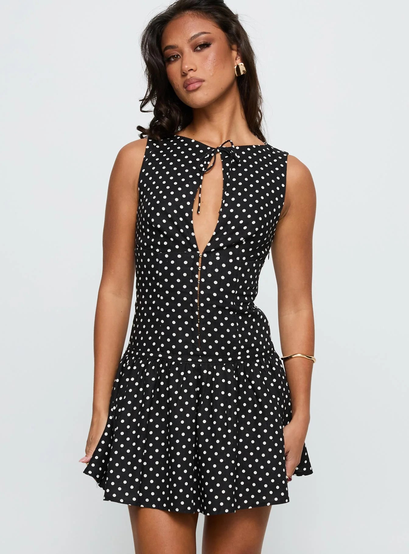 Back view of sleeveless polka dot homecoming dress.