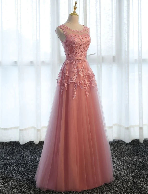 Back view of a long A-line prom dress featuring lace and tulle.