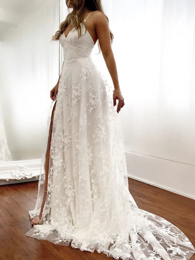 Elegant A-line lace wedding dress with spaghetti straps and high slit.