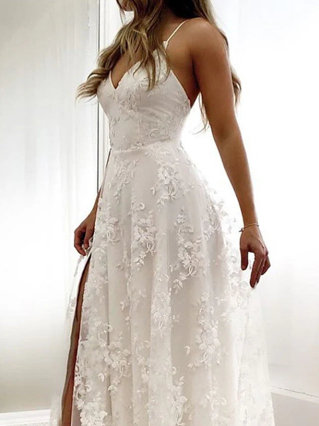 Full length view of a bride wearing a long A-line wedding dress.