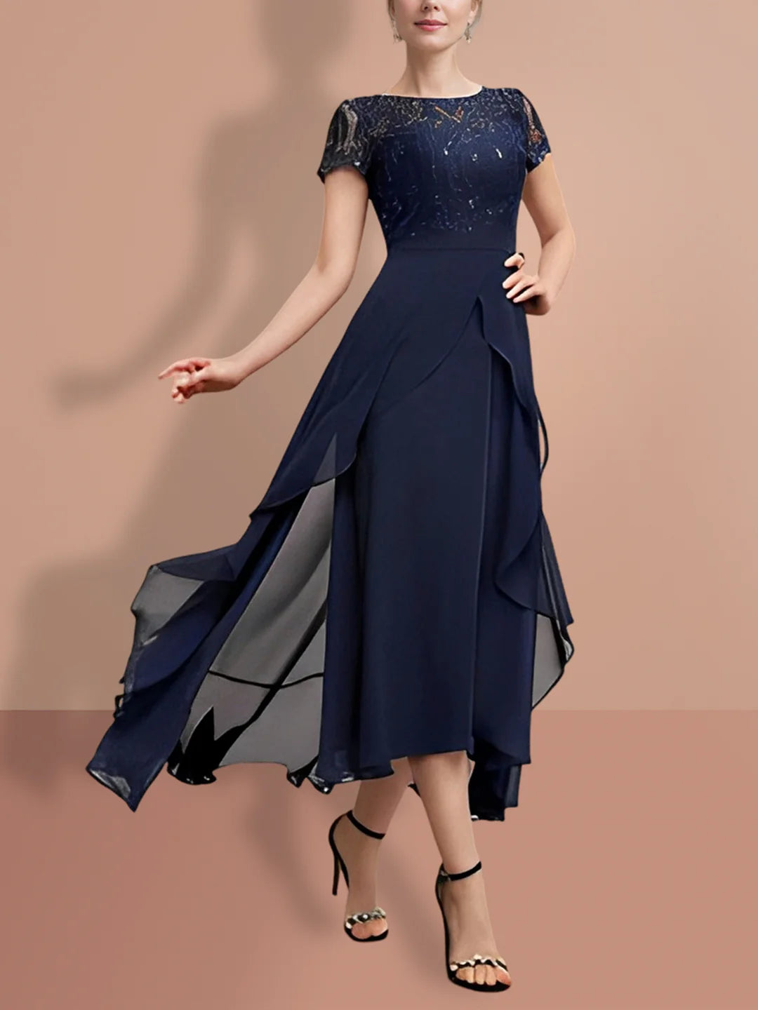 Woman wearing an elegant A-line lace knee-length Mother of the Bride dress with short sleeves.