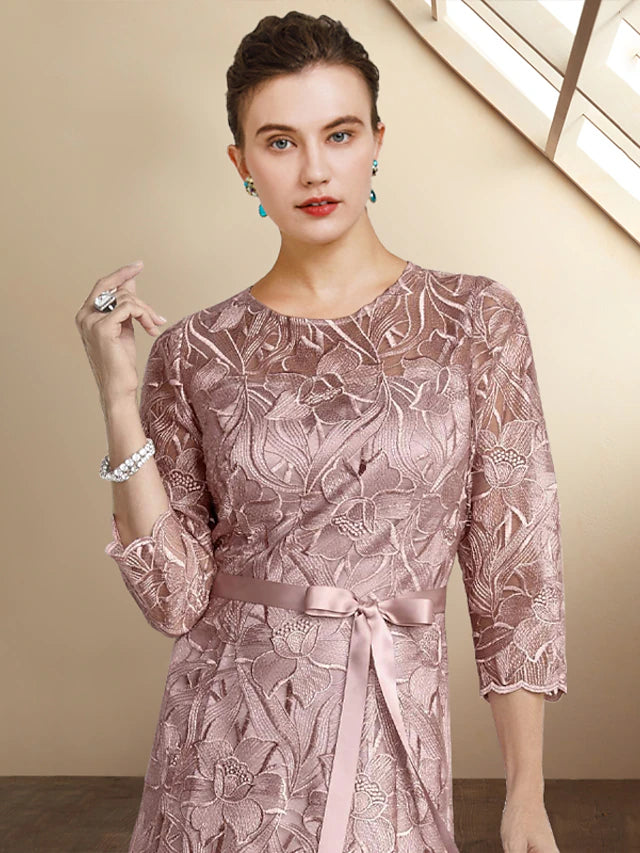 Back view of the A-line lace dress with ribbon bow detail.
