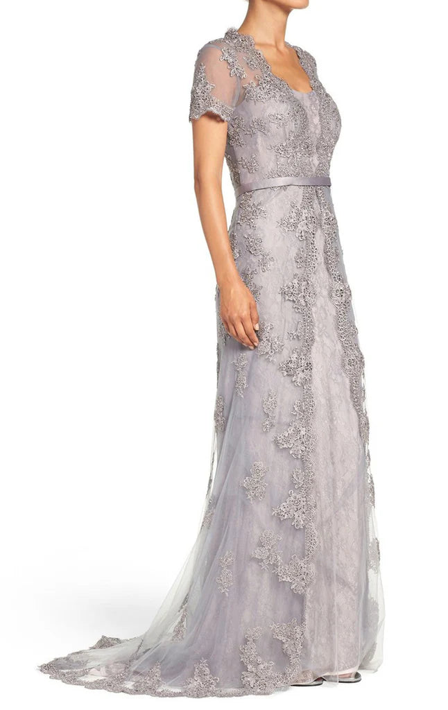 Back view of the elegant short sleeve lace dress, highlighting its formal design.