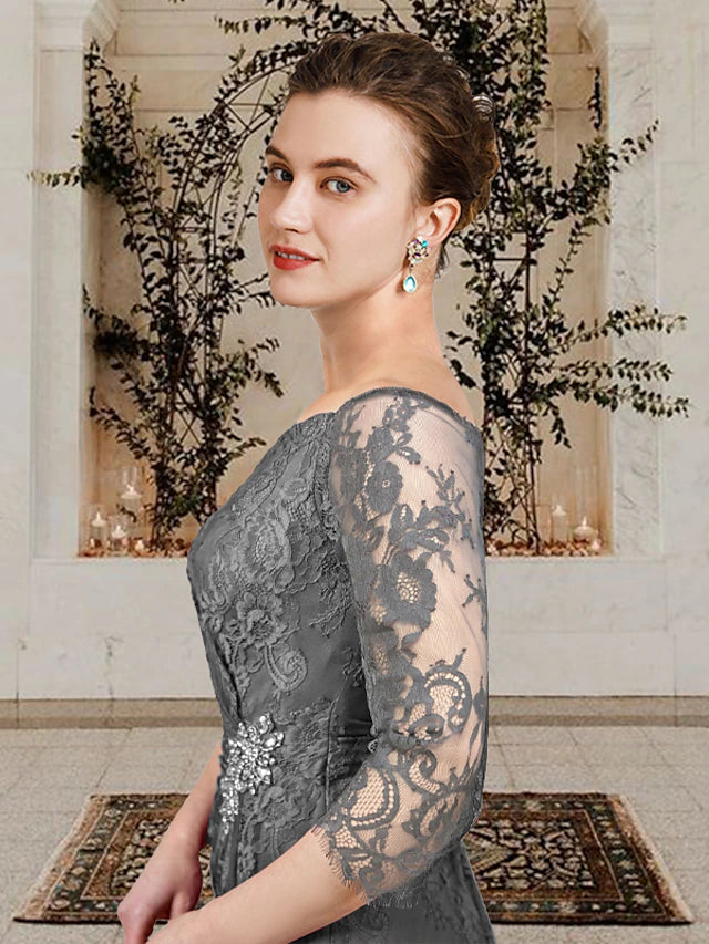 Side view of an elegant plus size Mother of the Bride dress, showing side-draped detail and ruffles.