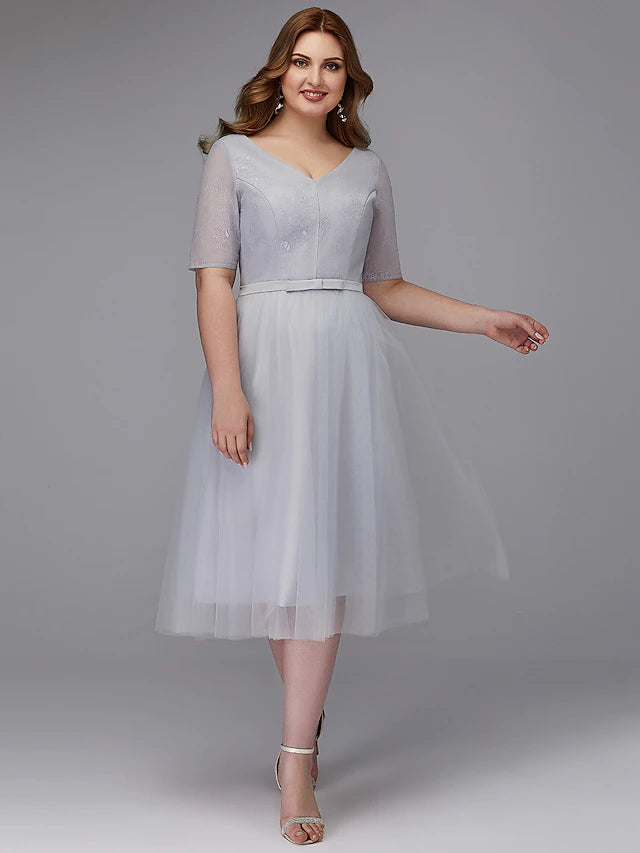 Elegant A-line lace V-neck tea length dress.