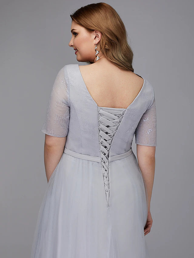 Back view of A-line lace dress with lace-up detail.