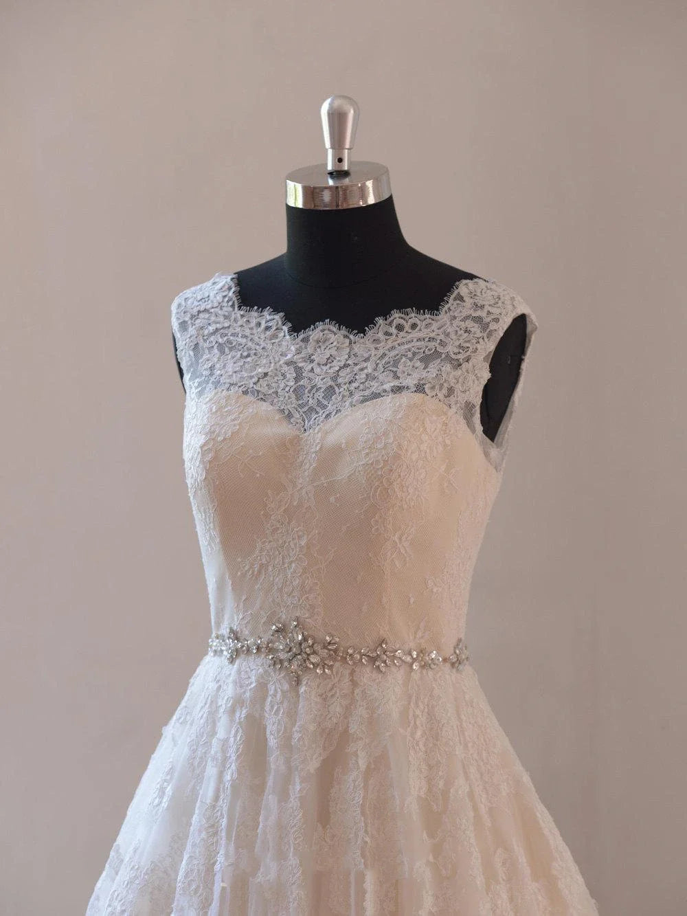 Side view of the A-line wedding dress, showcasing its flowing skirt.