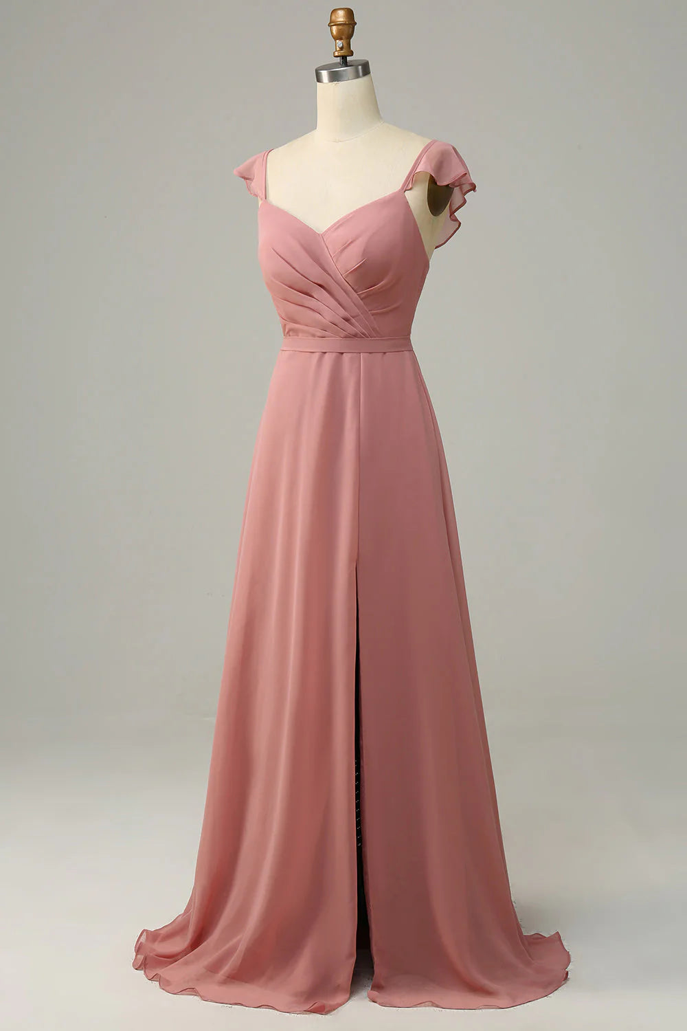 Back view of a woman in a dusty rose A-line long bridesmaid dress.