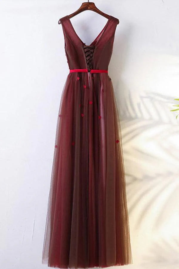 Side view of the A-line long sleeve prom dress showing appliques.